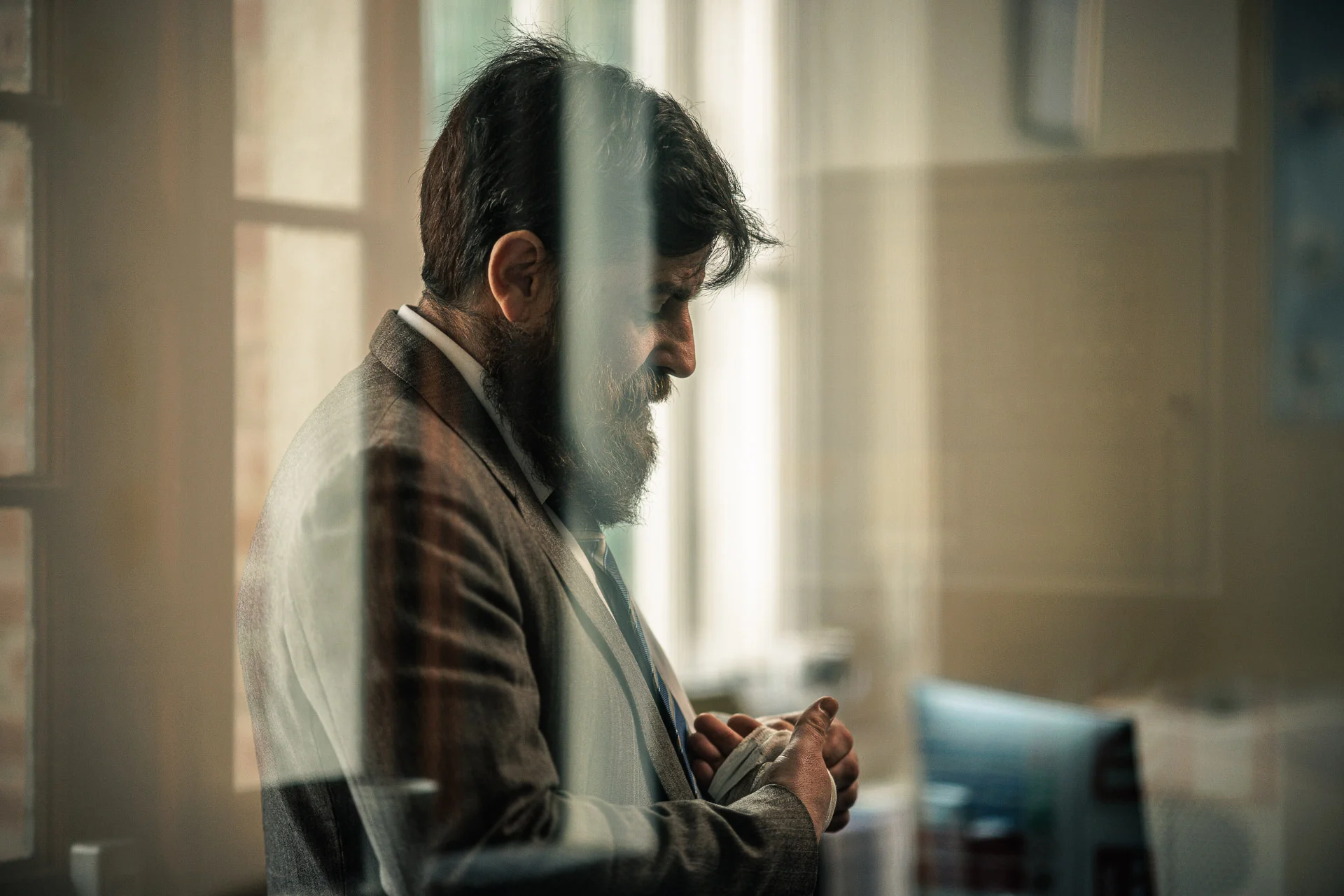 Irish actor Brian Matthews Murpy's profile in character as Detective Reilly. glass reflections break up the photo and add interest