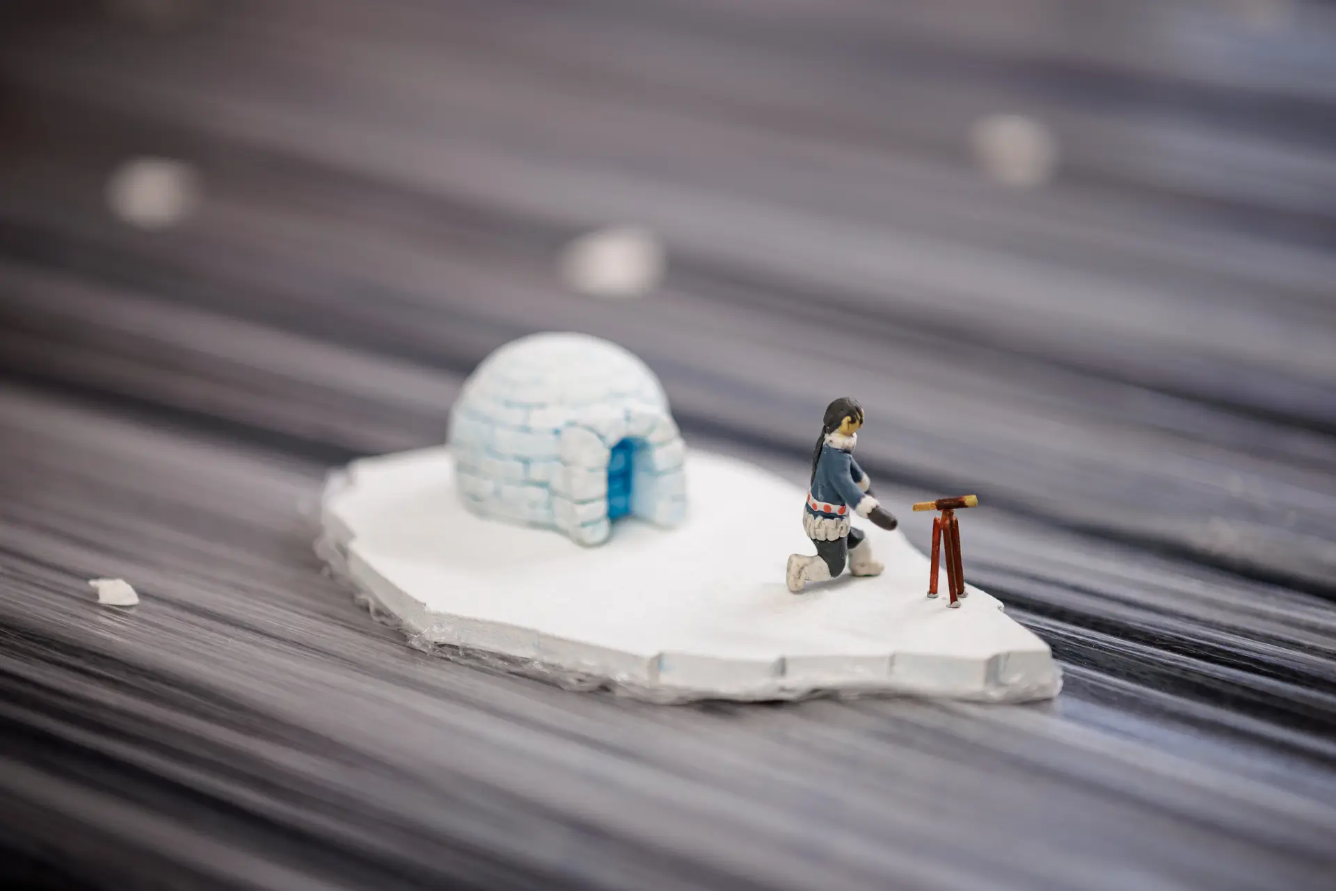 An 'aerial shot' at roughly a 45 degree angle of Kova on her small iceberg,