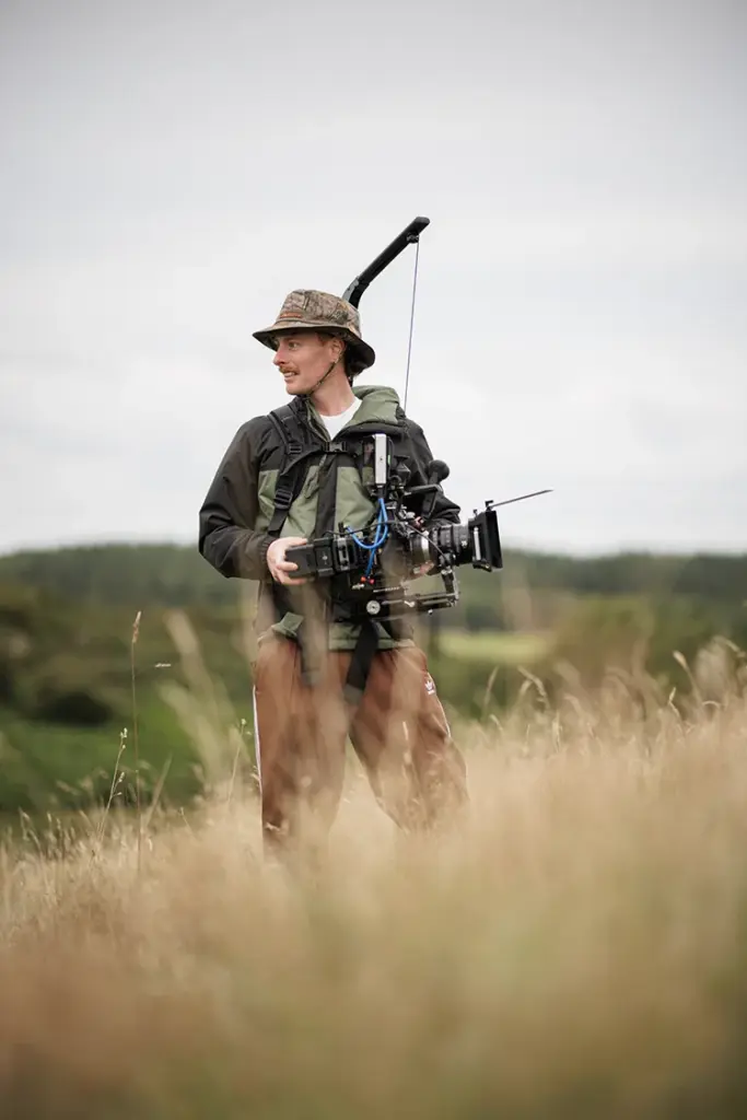 BTS of Michael Behan on the set of Field Queens