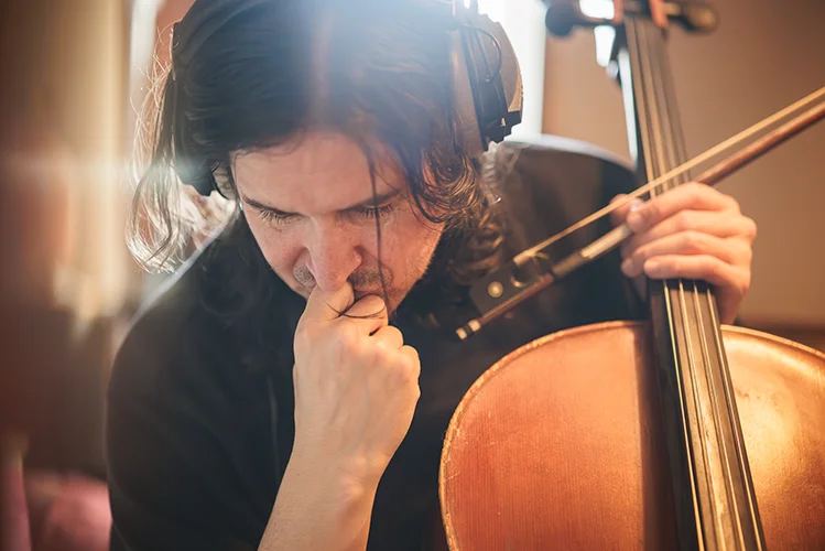BTS of Cellist Aongus MacAmlaigh listening back to his recording in Graham Tully's sound studio for stop motion short "Kova's Courage"